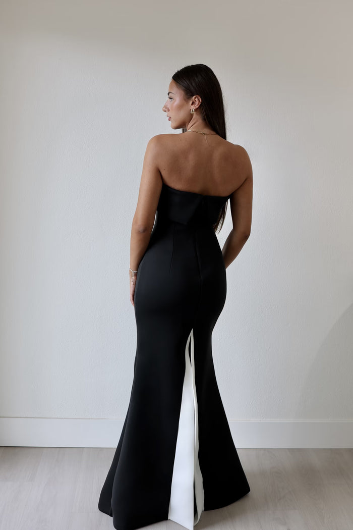 How to style Australian designer dresses for a night out – woman in elegant black maxi dress by BELLA n' BEAR