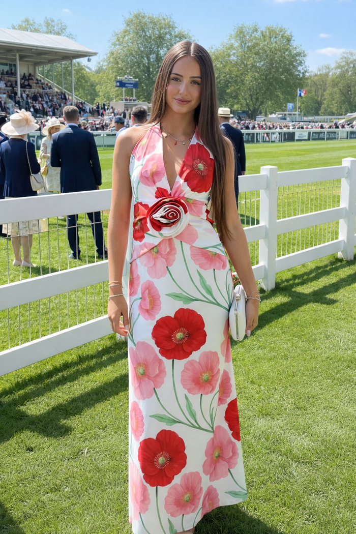 Model wearing a pink floral midi dress at an outdoor event in Australia