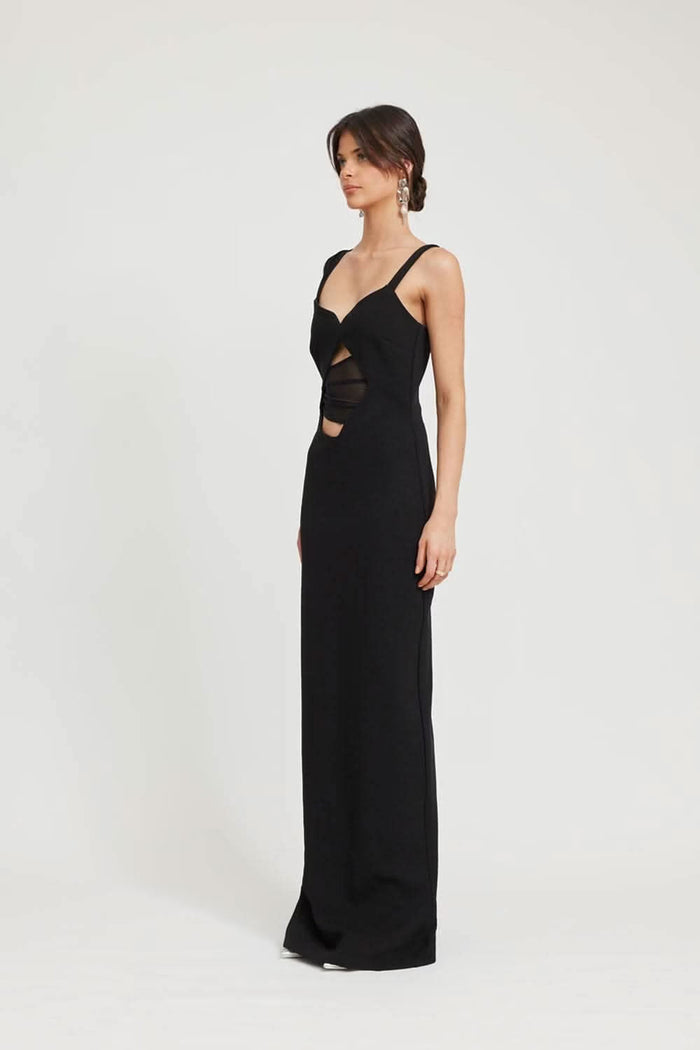 Model wearing TOJHA Madeleine black maxi evening dress with cut-out detail, styled for a formal Australian occasion