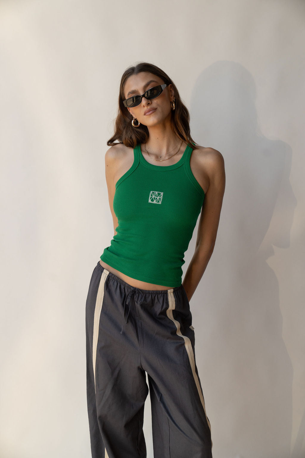 Model wearing Deep Green Monogram Tank by Araminta James