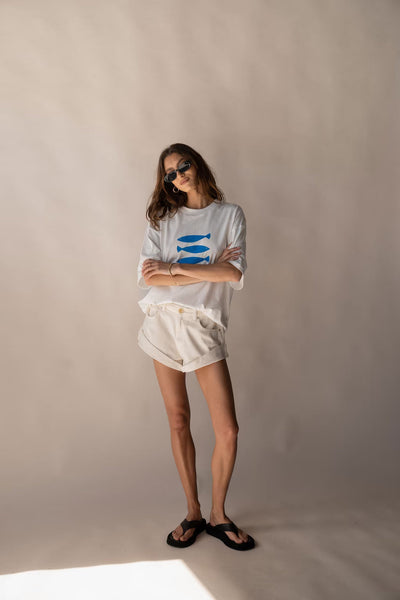 model wearing araminta james marina tee and goldie denim short