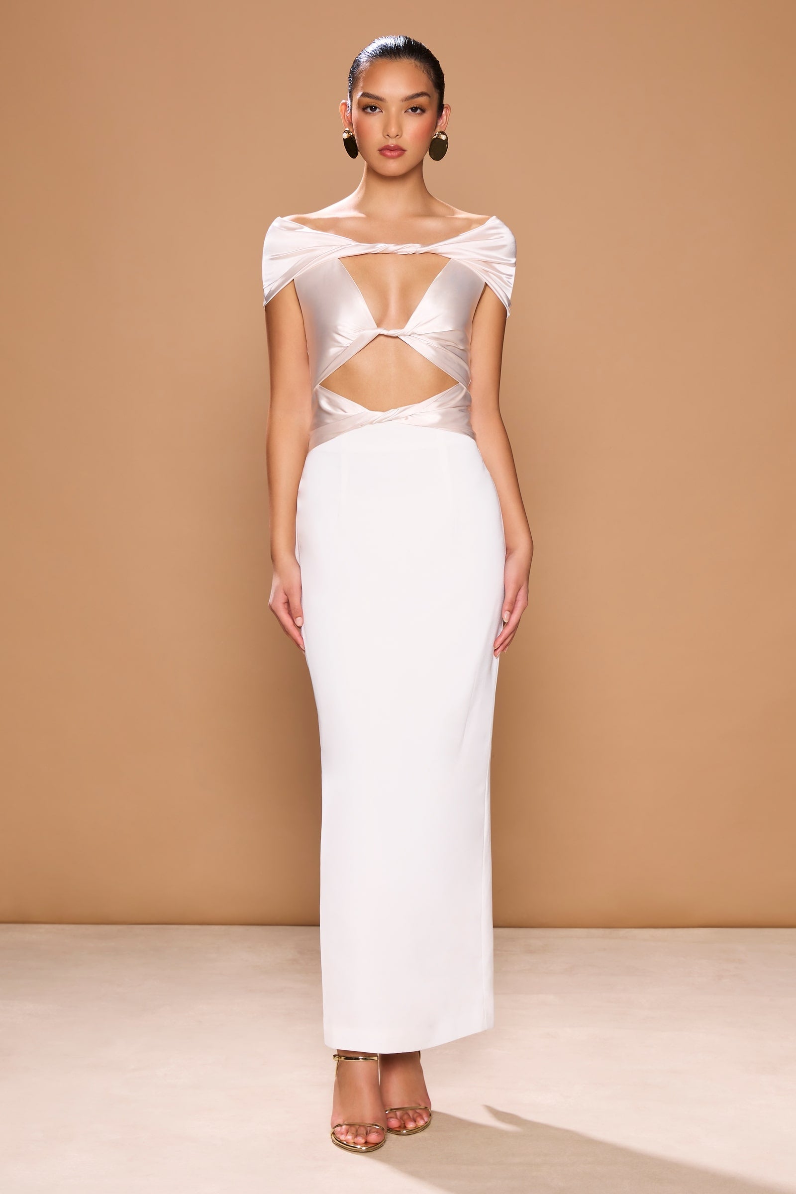 a model in a white Sonya Moda Pisa Dress