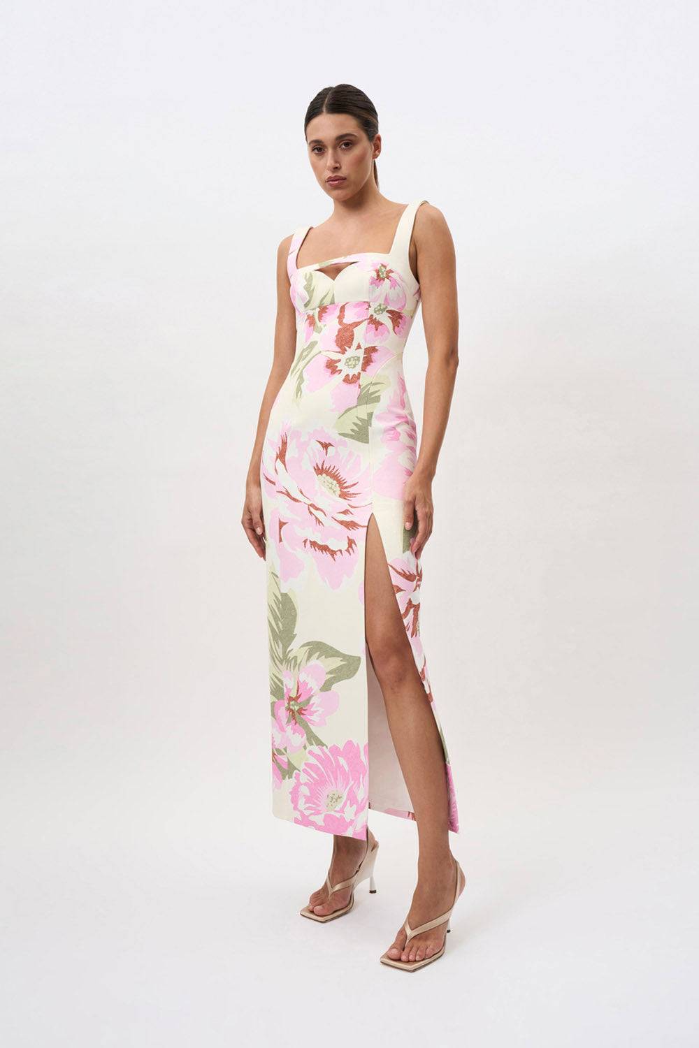 a woman in a By Johnny Edens Floral Square Peep Dress