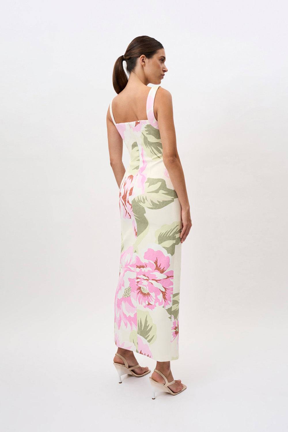 a woman in a By Johnny Edens Floral Square Peep Dress