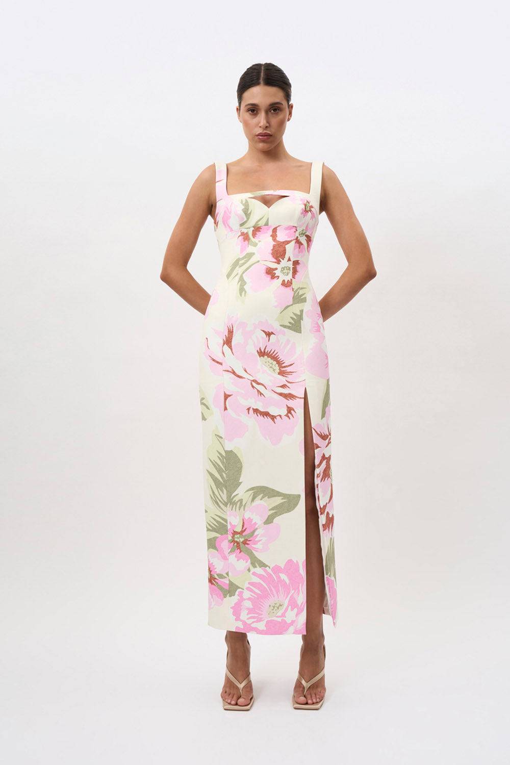 a woman in a By Johnny Edens Floral Square Peep Dress