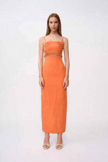 Woman wearing an orange dress with a white background