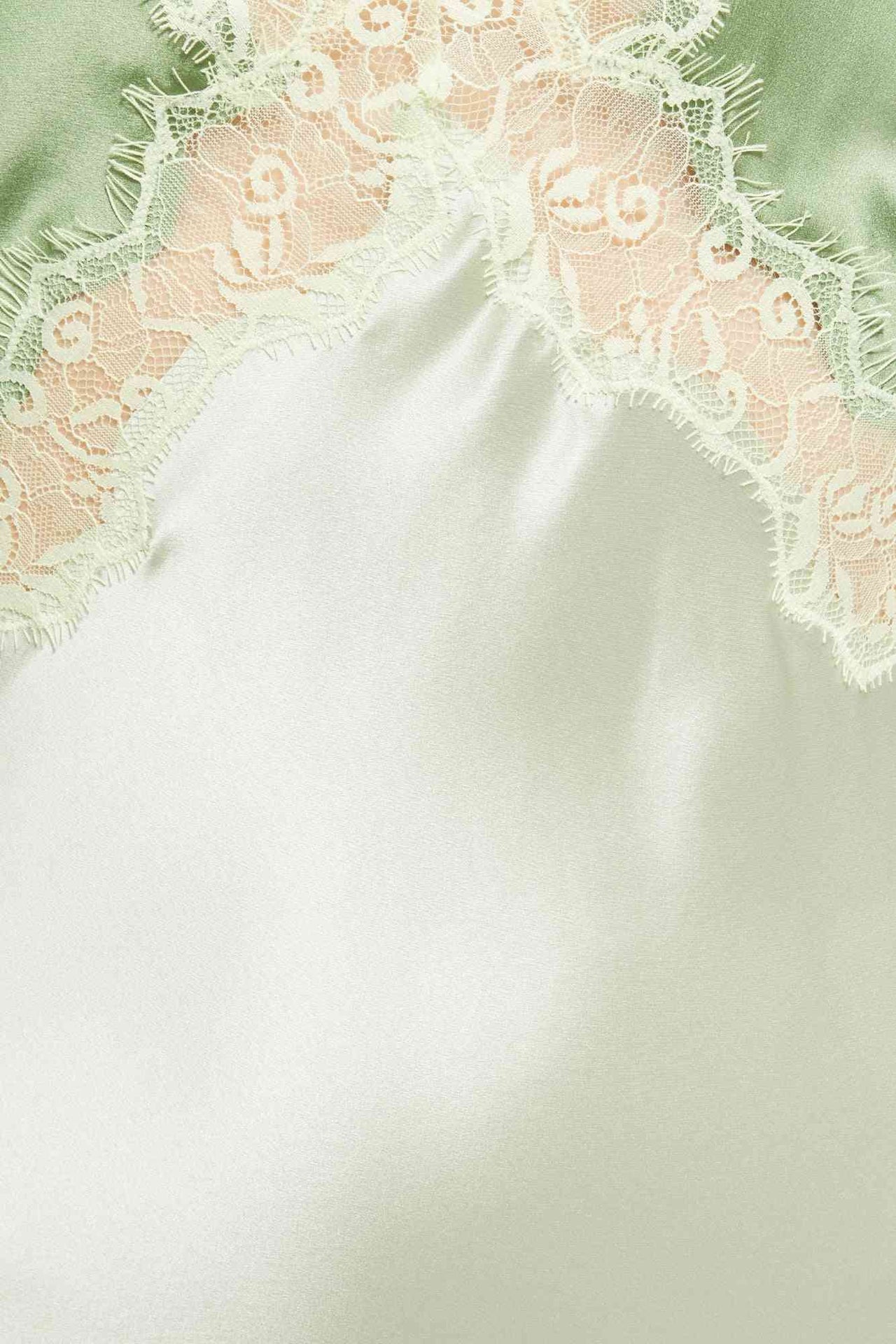 a close up of a green and white Ginia Frida Lace Dress