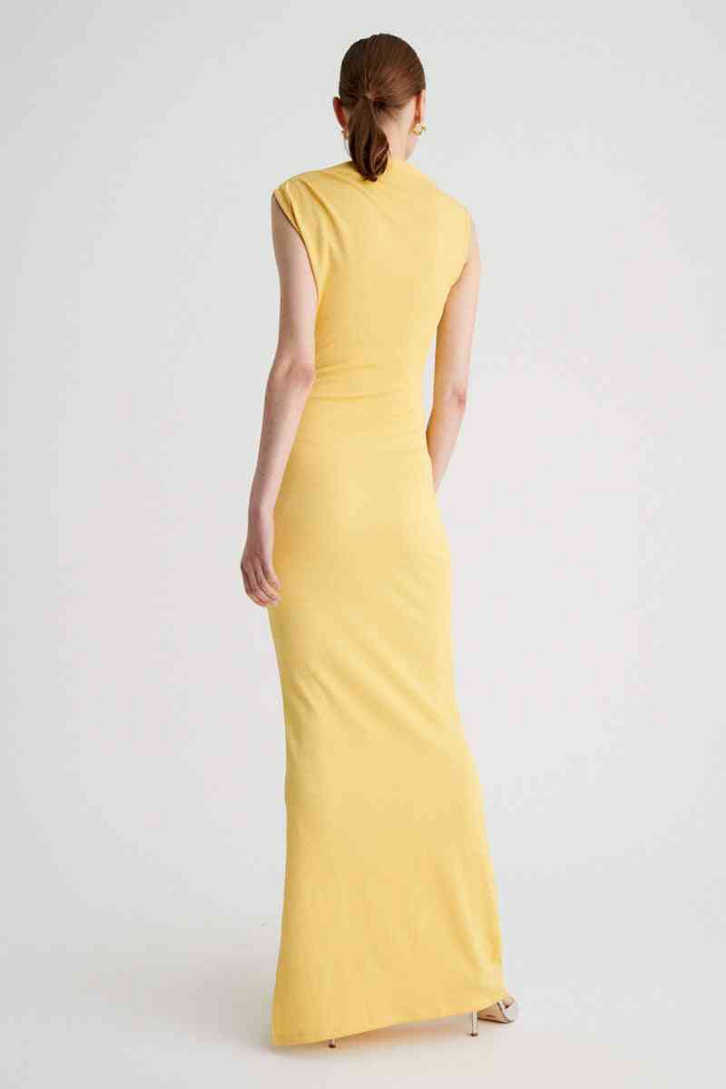 a woman in a yellow Suboo Vega Rouched Front Midi Dress in Butter