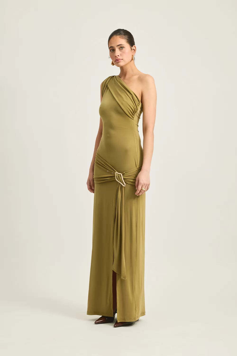 One-shoulder olive green maxi dress with a knotted detail at the waist and a side slit.