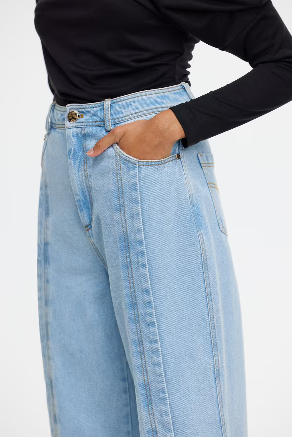 Midwash denim jeans with waistband button, belt loops, and front pockets