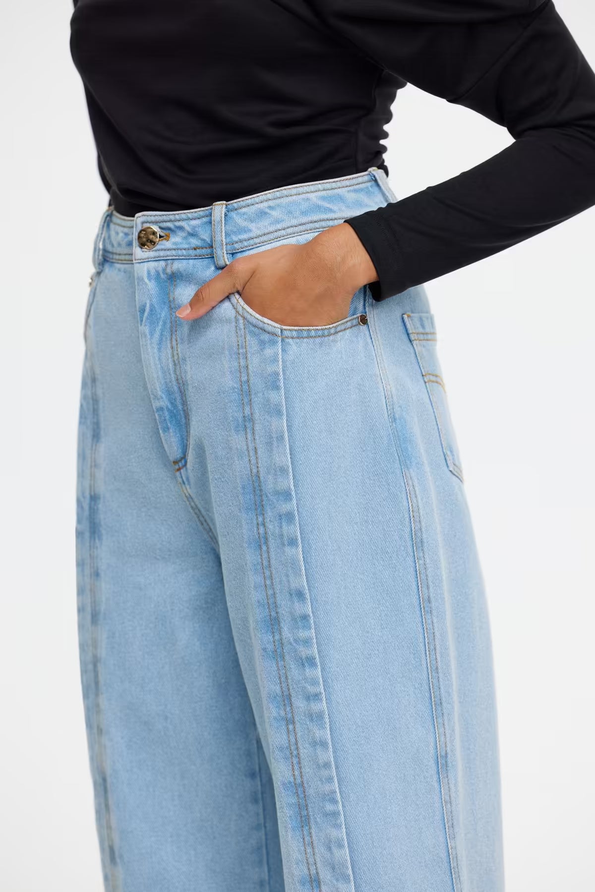 Midwash denim jeans with waistband button, belt loops, and front pockets