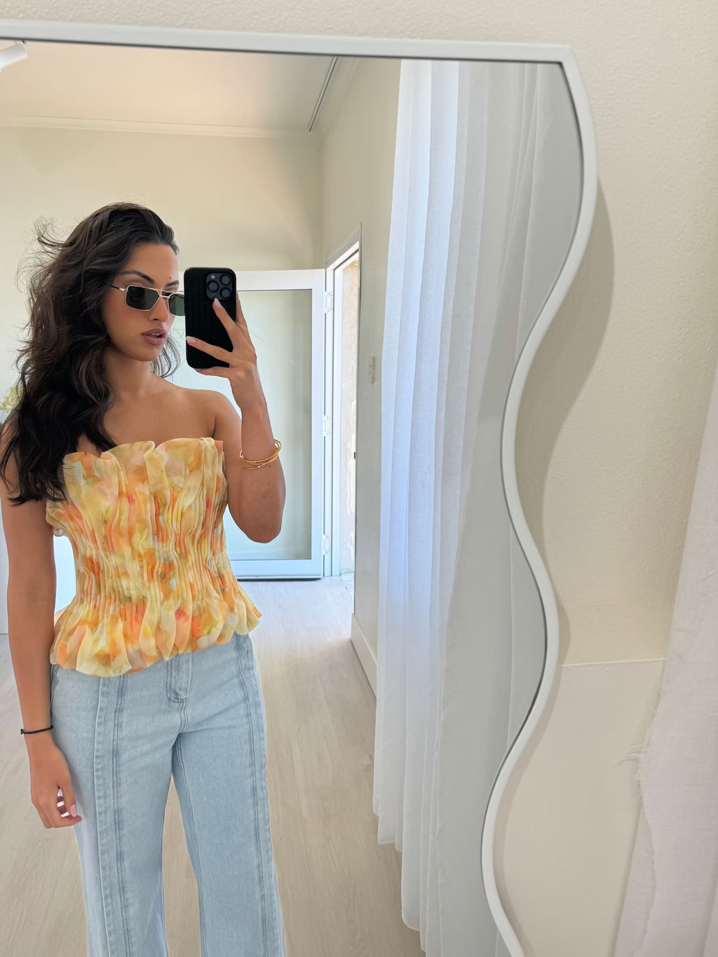 Midwash wide-leg denim jeans, worn with high-rise fit