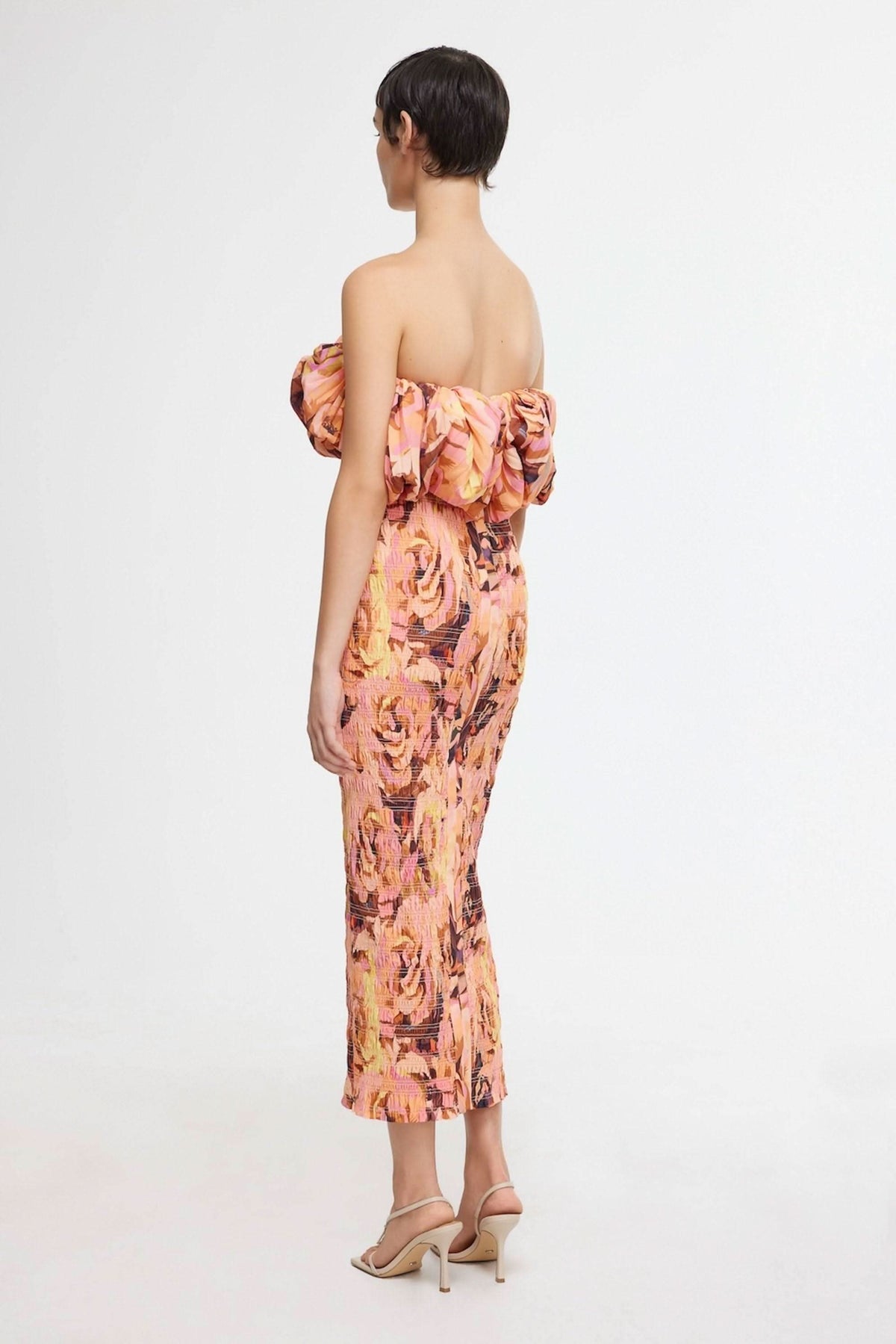 Back view floral midi dress with ruffled off-shoulder neckline and fitted fit