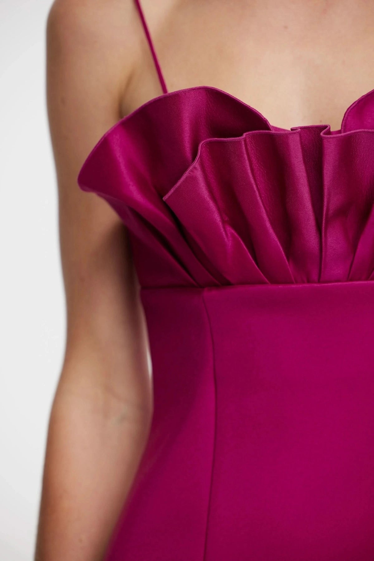 Mahina plum dress close-up: ruched bust with layered ruffle at neckline