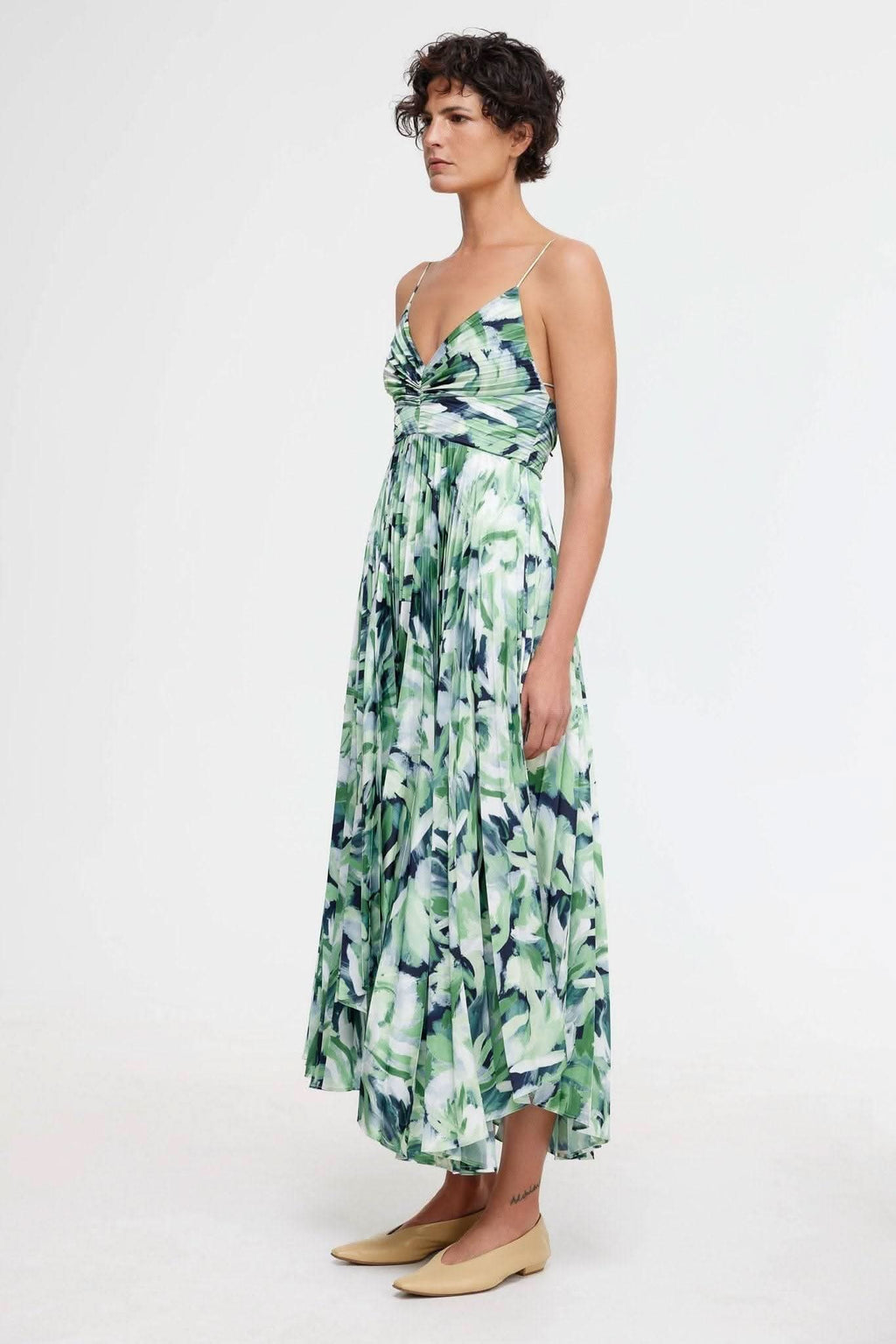 Green and blue leafy print midi dress with ruched bodice and spaghetti straps