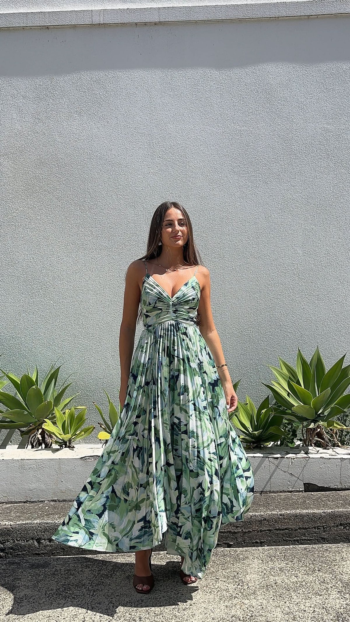 Green leafy print midi dress with spaghetti straps and gathered skirt