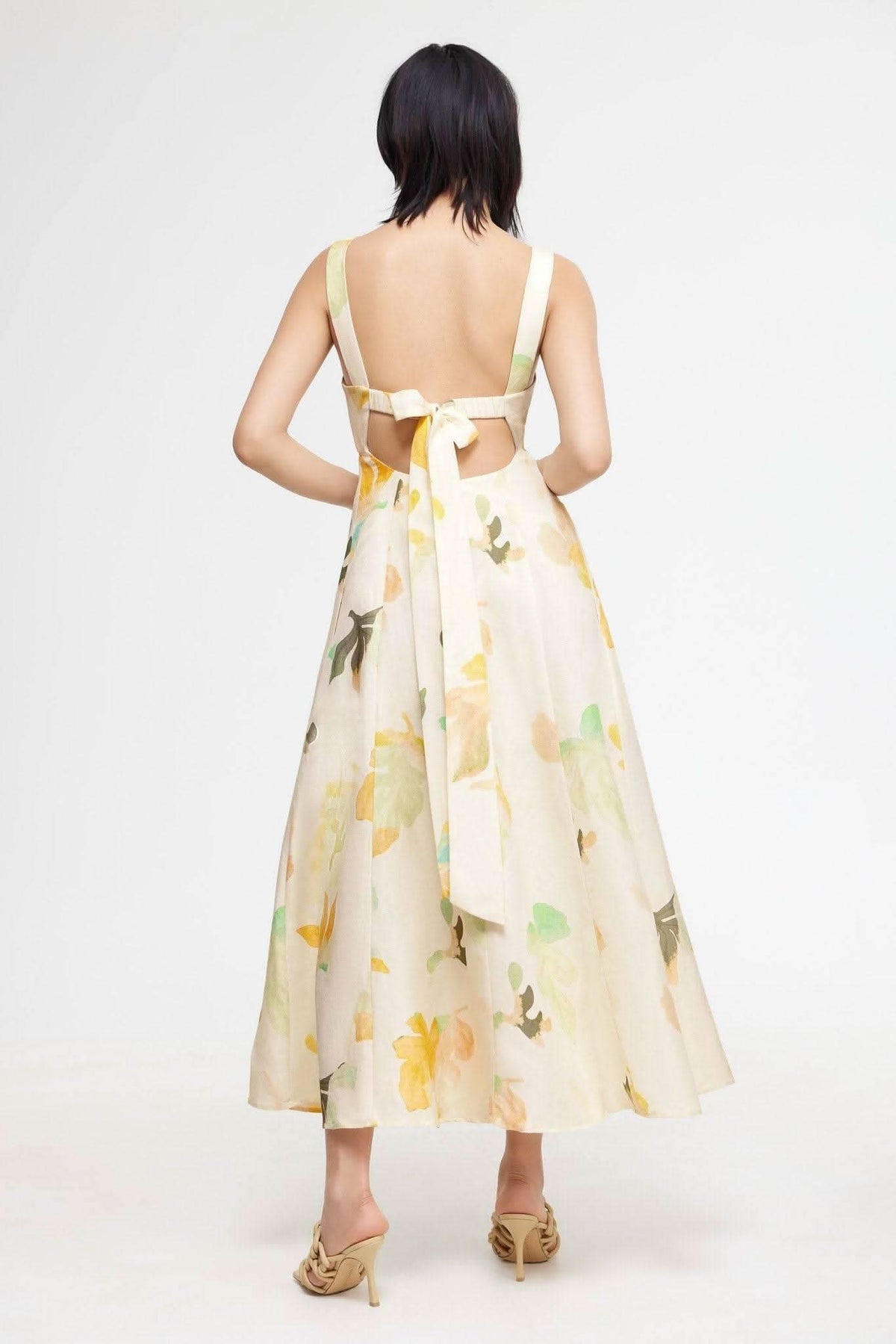 Backless floral midi dress with crisscross straps and waist ribbon, cream with flower print
