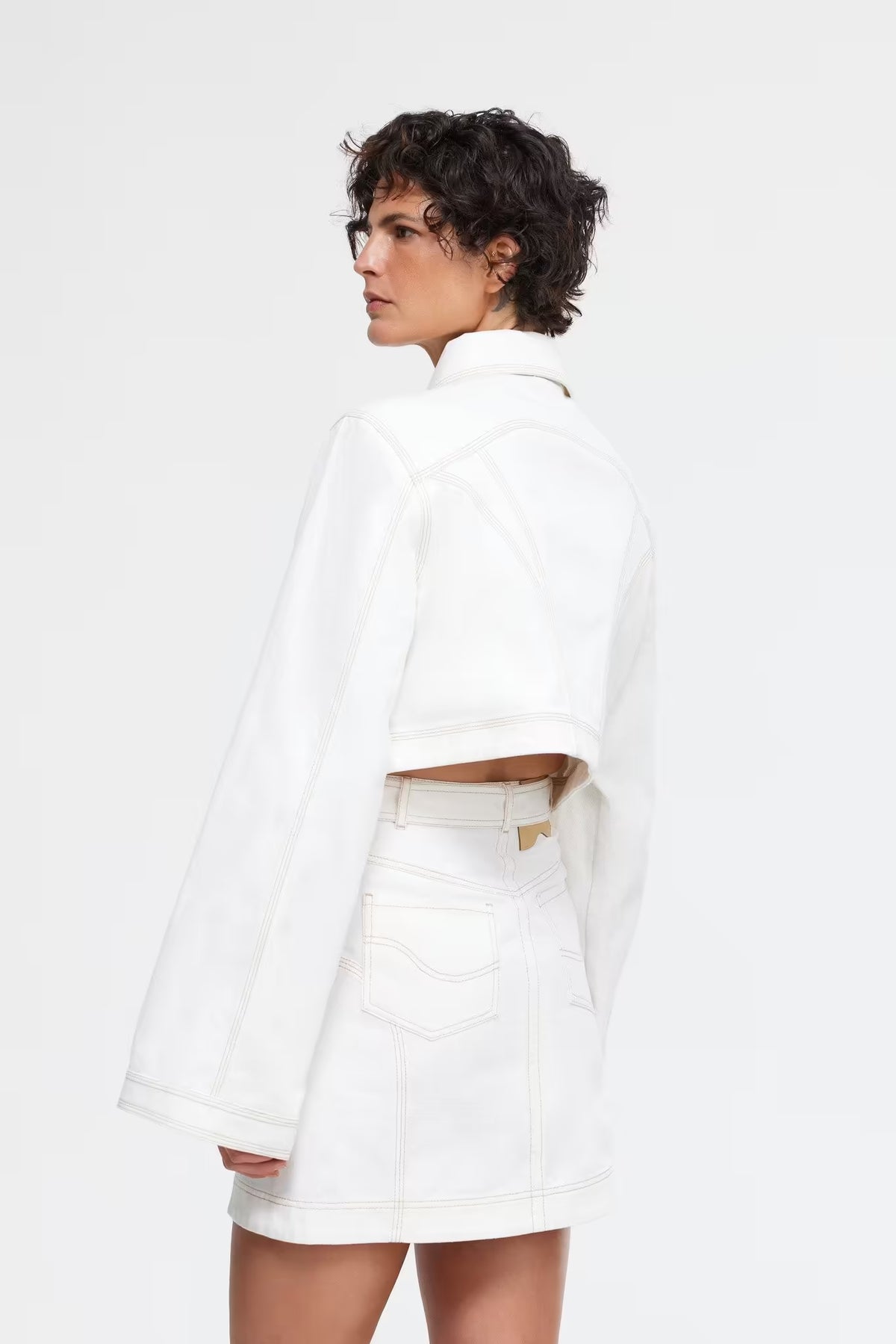 Ivory cropped jacket back view with pointed collar and long sleeves