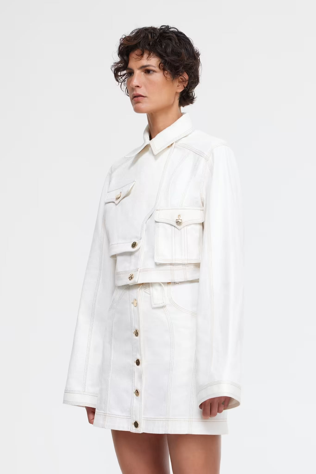 Ivory cropped button-front jacket with flap chest pockets and long sleeves