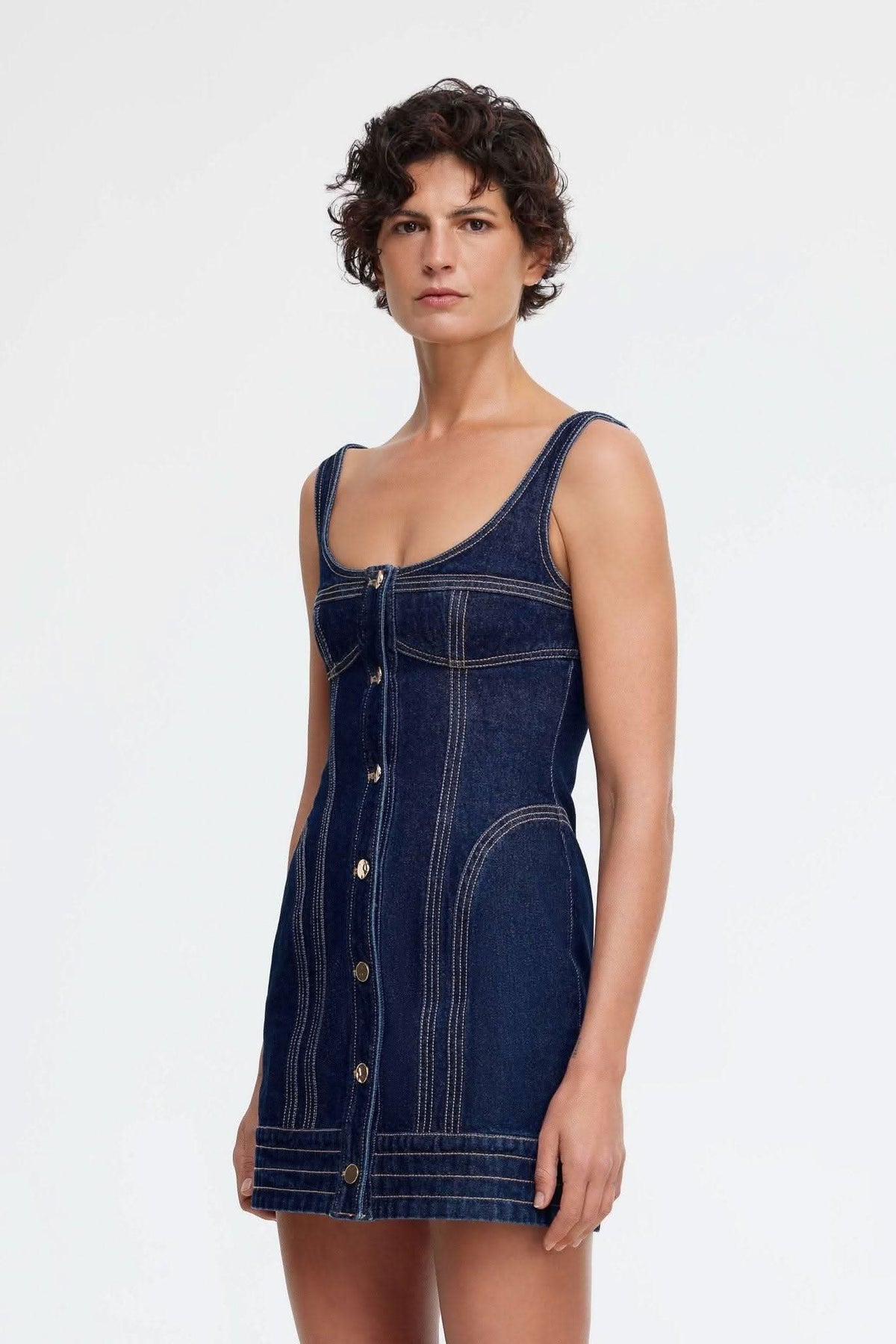 Dark indigo denim mini dress, sleeveless scoop neck, button placket