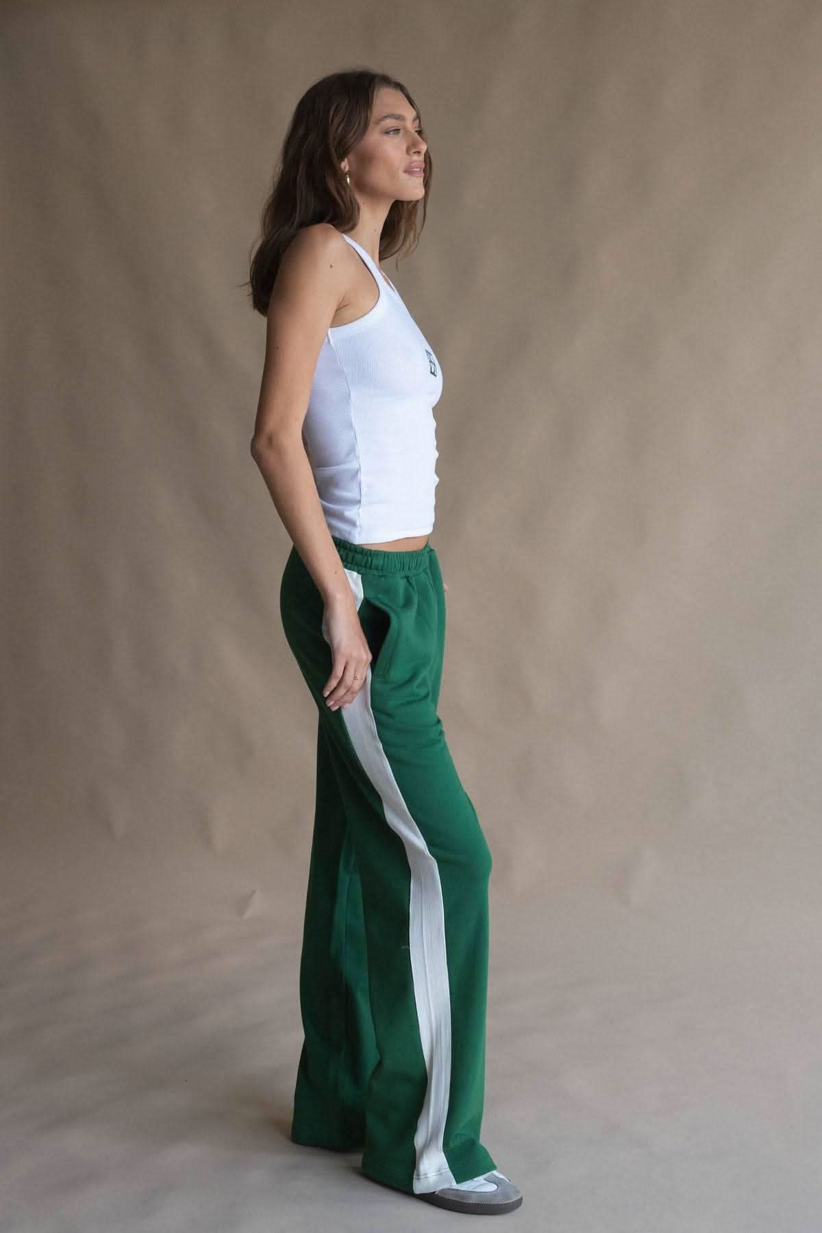White scoop-neck tank top with square monogram patch, side view
