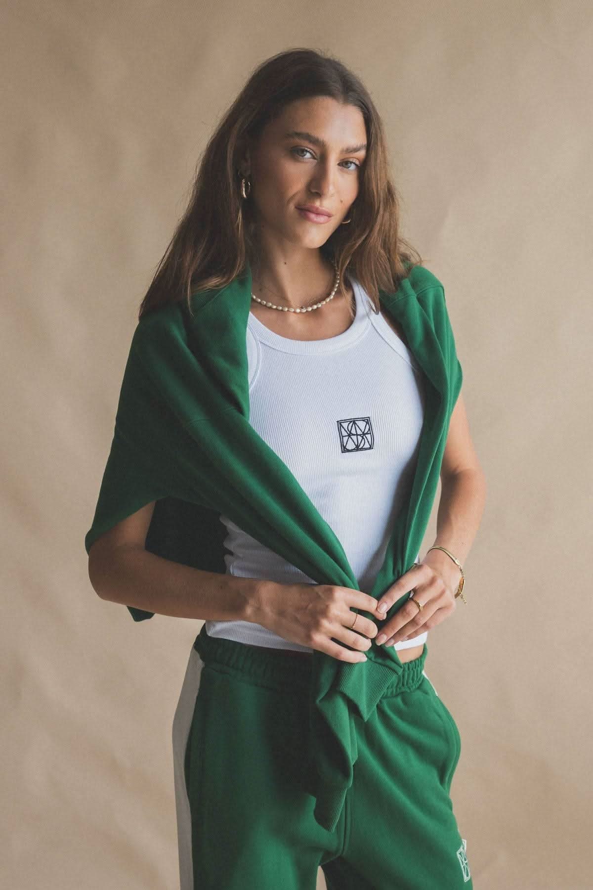 White scoop-neck tank top with square monogram patch at chest