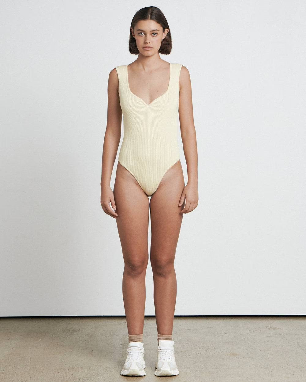 Butter sweetheart bodysuit, sleeveless with deep V neckline and high-cut leg