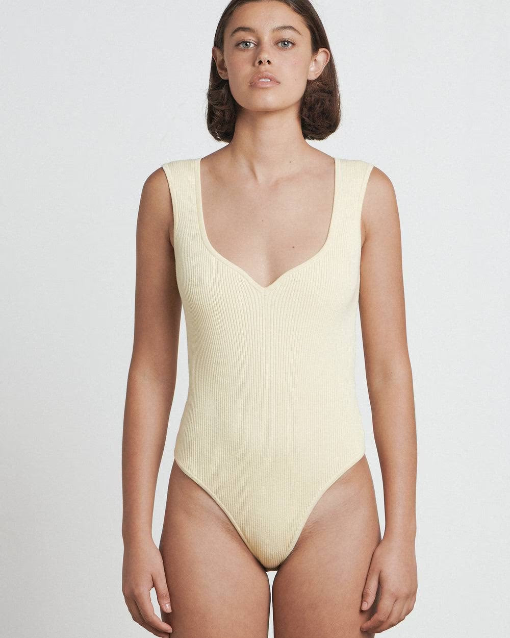 Butter sweetheart bodysuit, sleeveless deep V neckline, fitted textured knit, high-cut leg