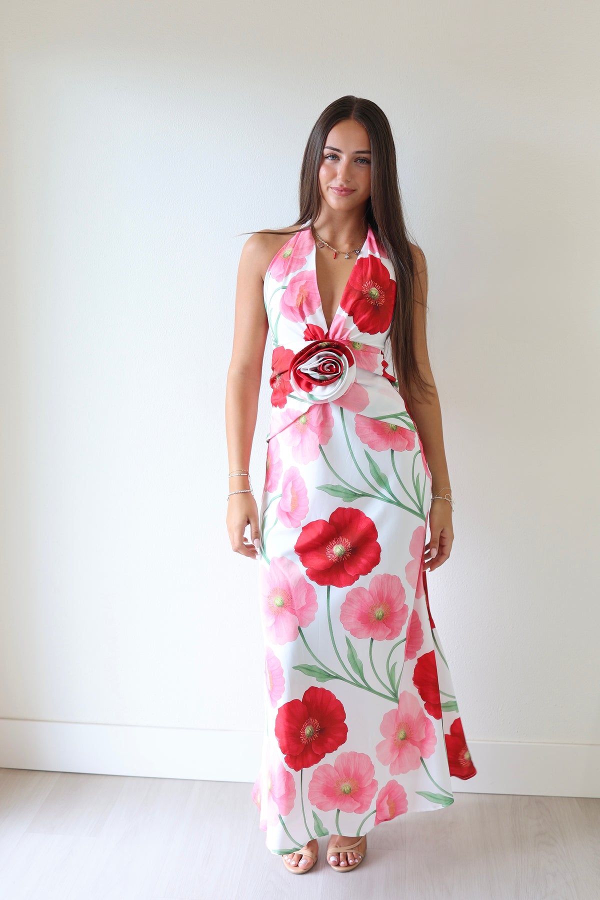 Floral halter maxi dress with pink and red poppy print, sleeveless with long hem