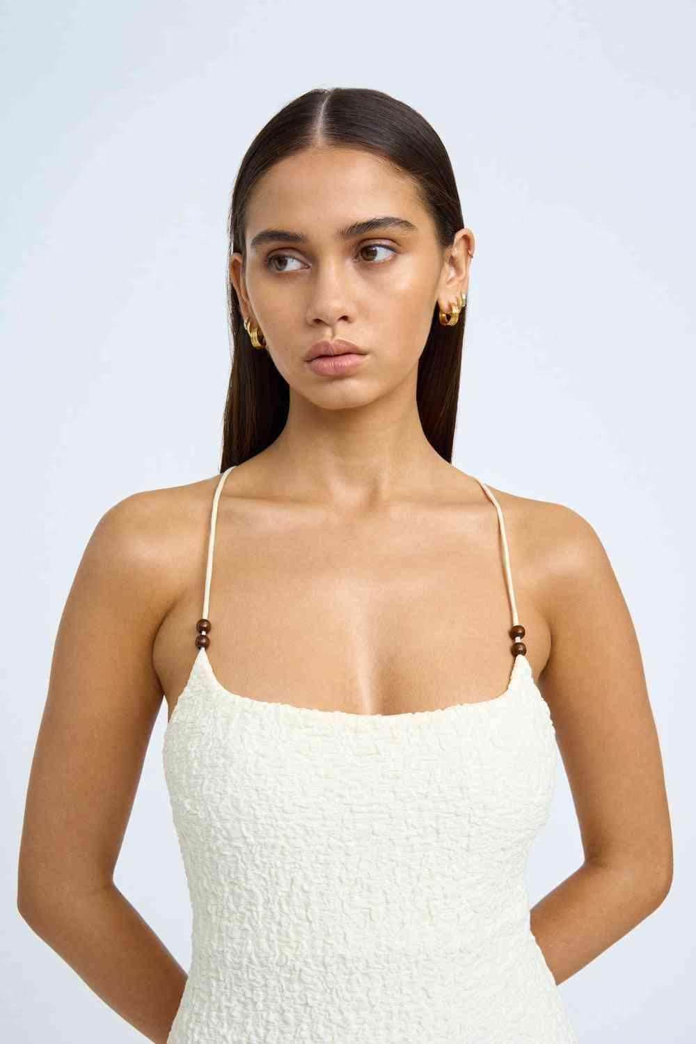 Ivory beaded midi dress front view with spaghetti straps and square neckline.