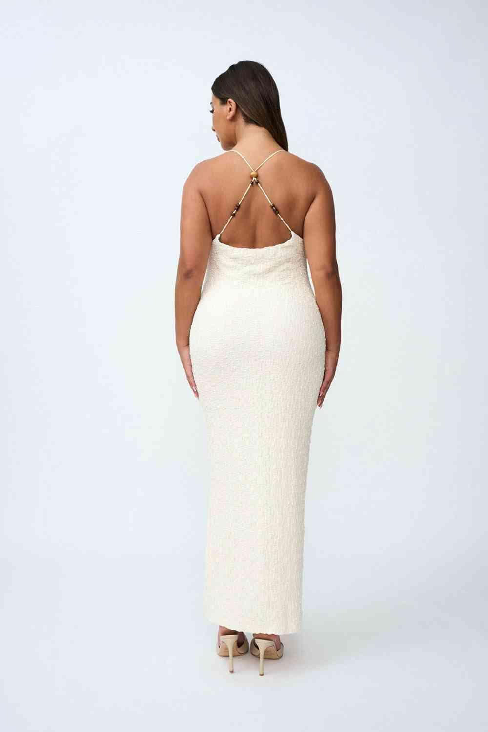 Ivory bead midi dress back view, crisscross beaded straps and fitted column silhouette.