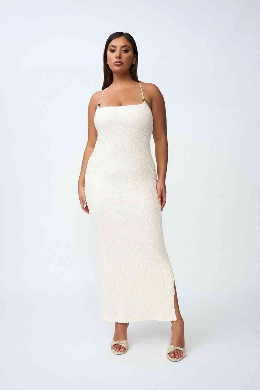 Ivory bead midi dress with spaghetti straps, midi length, and side slit.