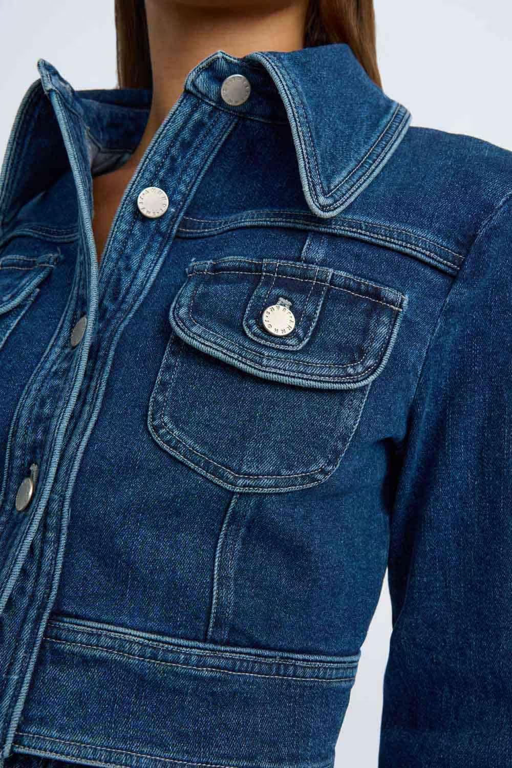 Indigo denim crop jacket close-up, flap chest pocket with snap buttons