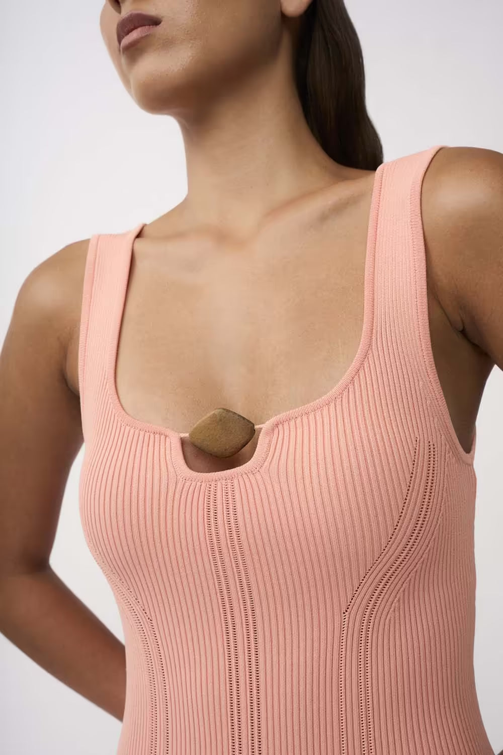 Peach ribbed knit dress with scoop neck and tan bead embellishment