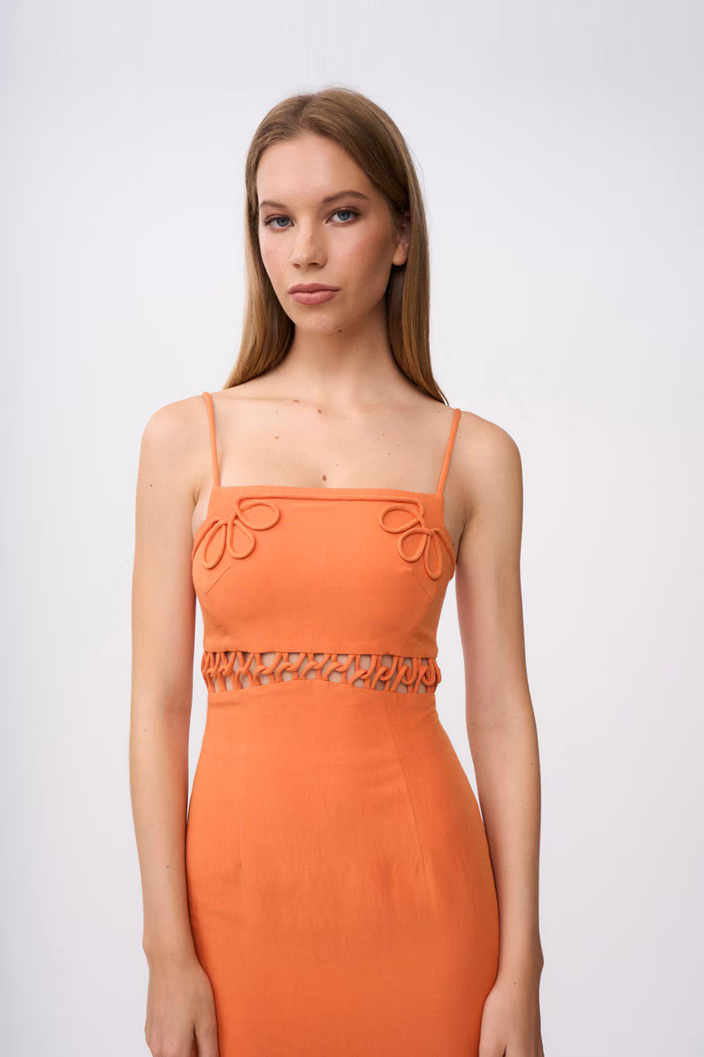 Orange linen ankle dress with spaghetti straps, loop trim, and fitted waist