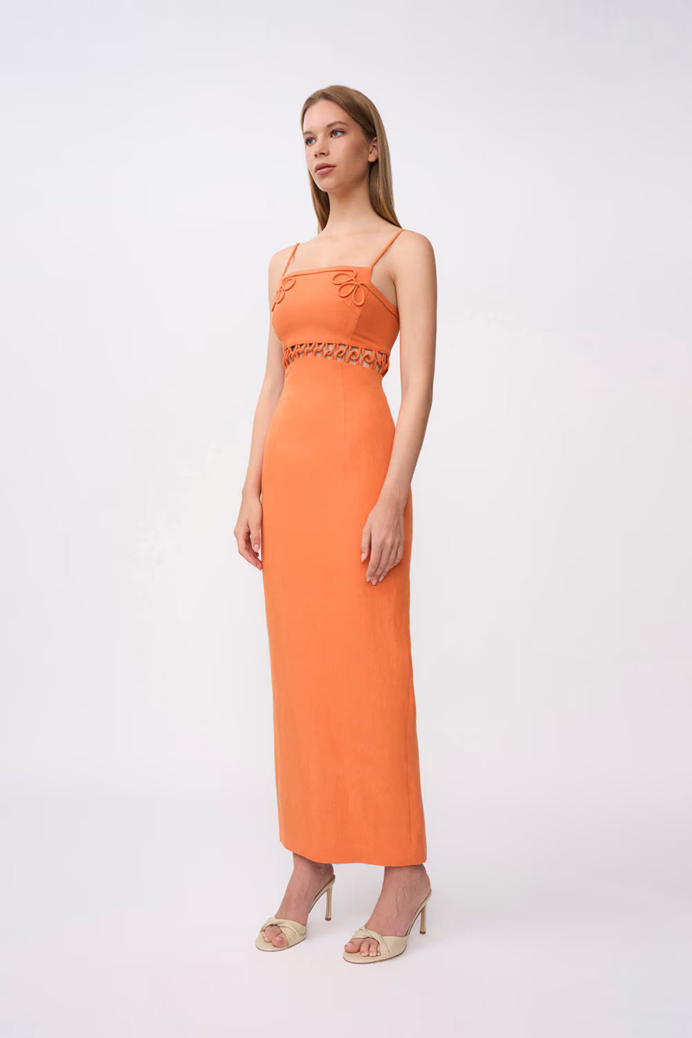 Orange linen midi dress with looped chest detail, tasseled waist trim, and straight skirt