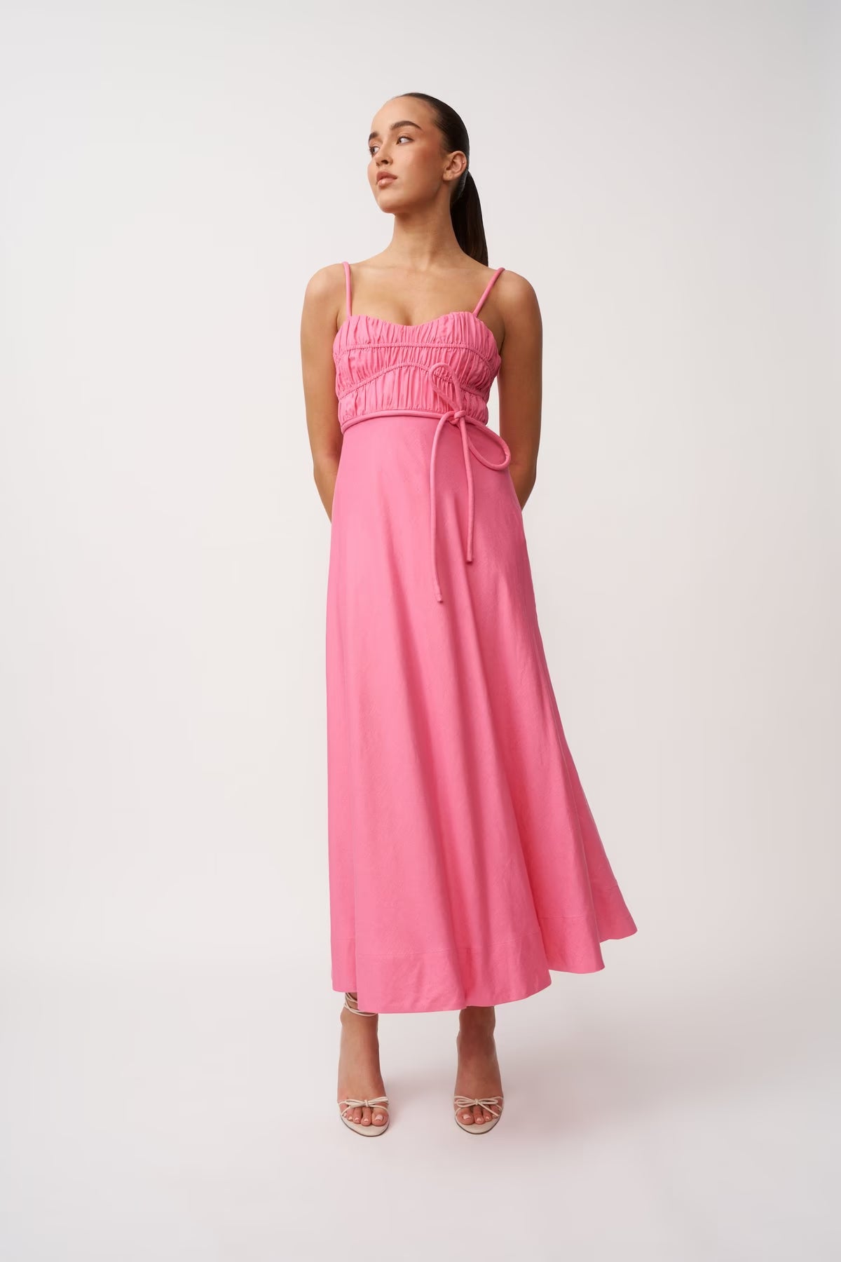 Pink midi panel dress with square neckline, spaghetti straps, gathered bodice, tie waist.