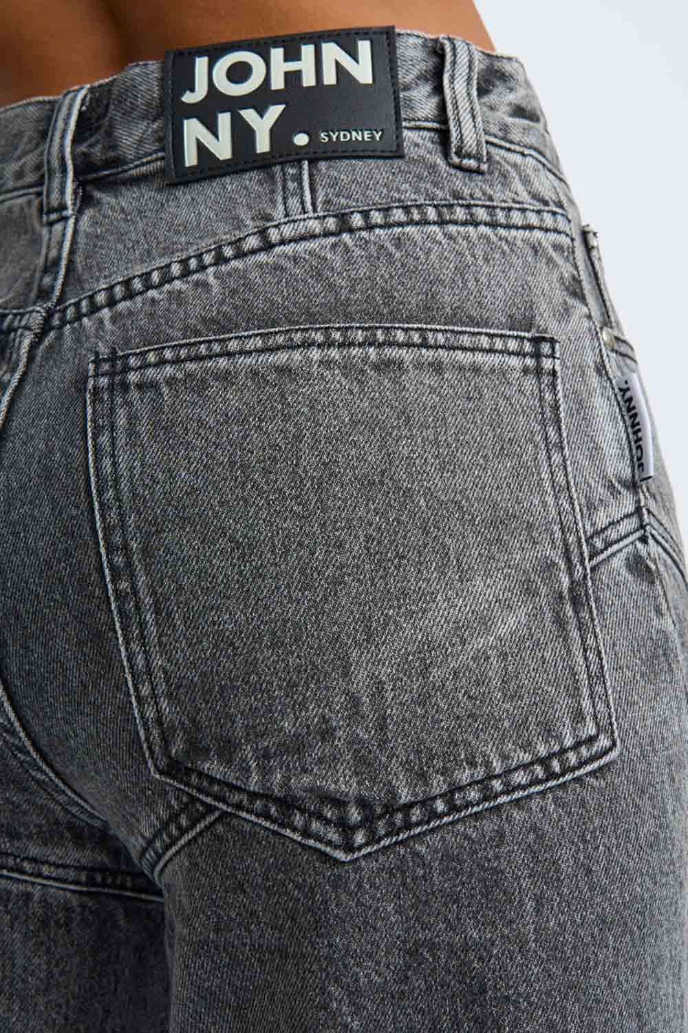 Grey stone-wash denim jeans with 'JOHN NY' label and stitched back patch pocket