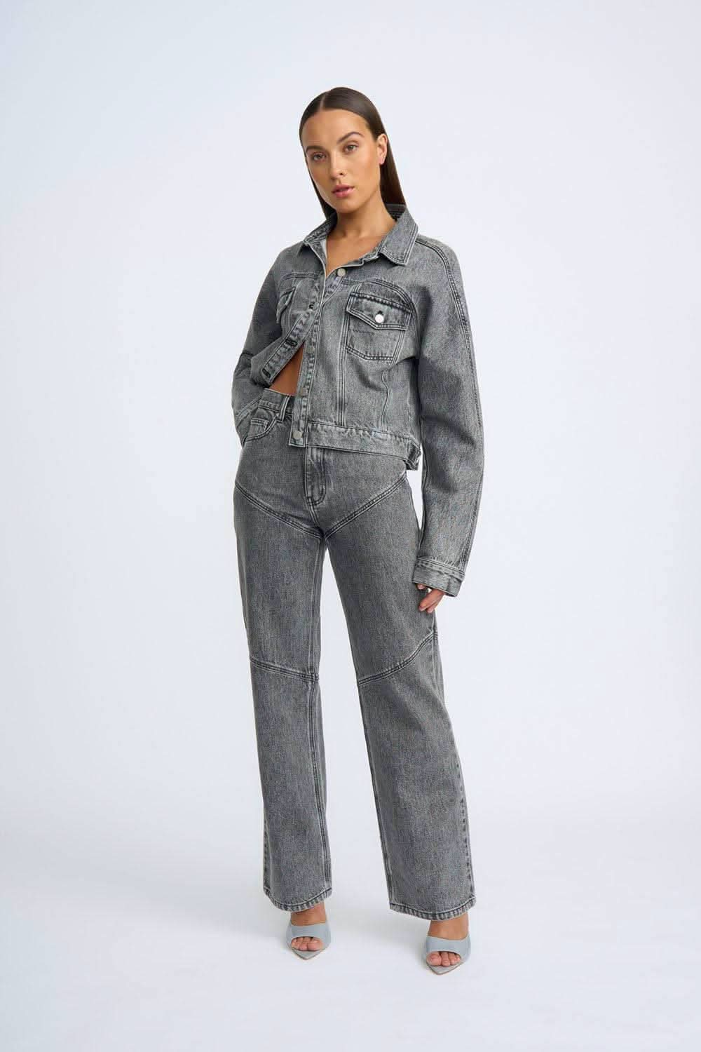 Grey stone-wash denim jeans with front pockets and straight wide-leg fit