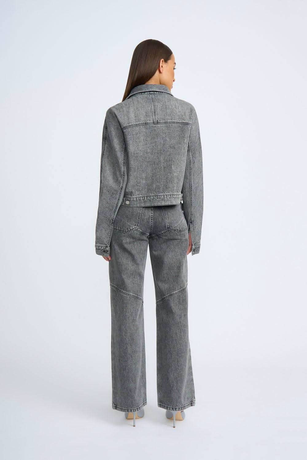 Grey stone-wash jeans, back view with yoke seam and wide-leg hems