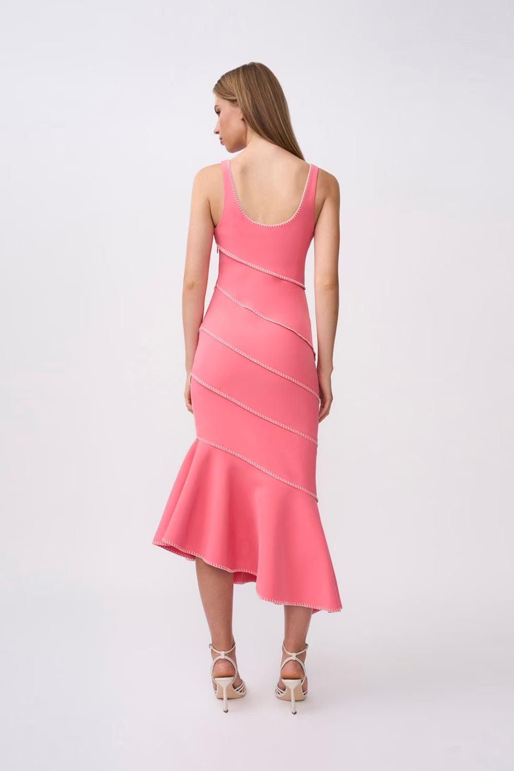 Pink spiral midi dress from back, sleeveless scoop back, flared tulip hem