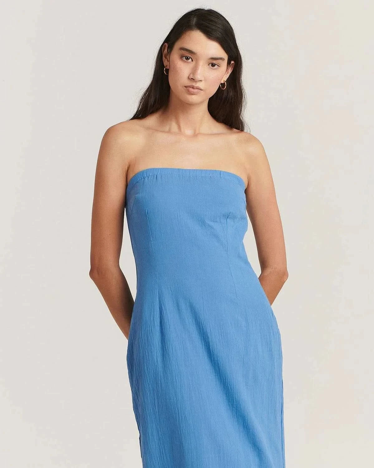 Dusty blue strapless midi dress, gathered bodice and fitted skirt