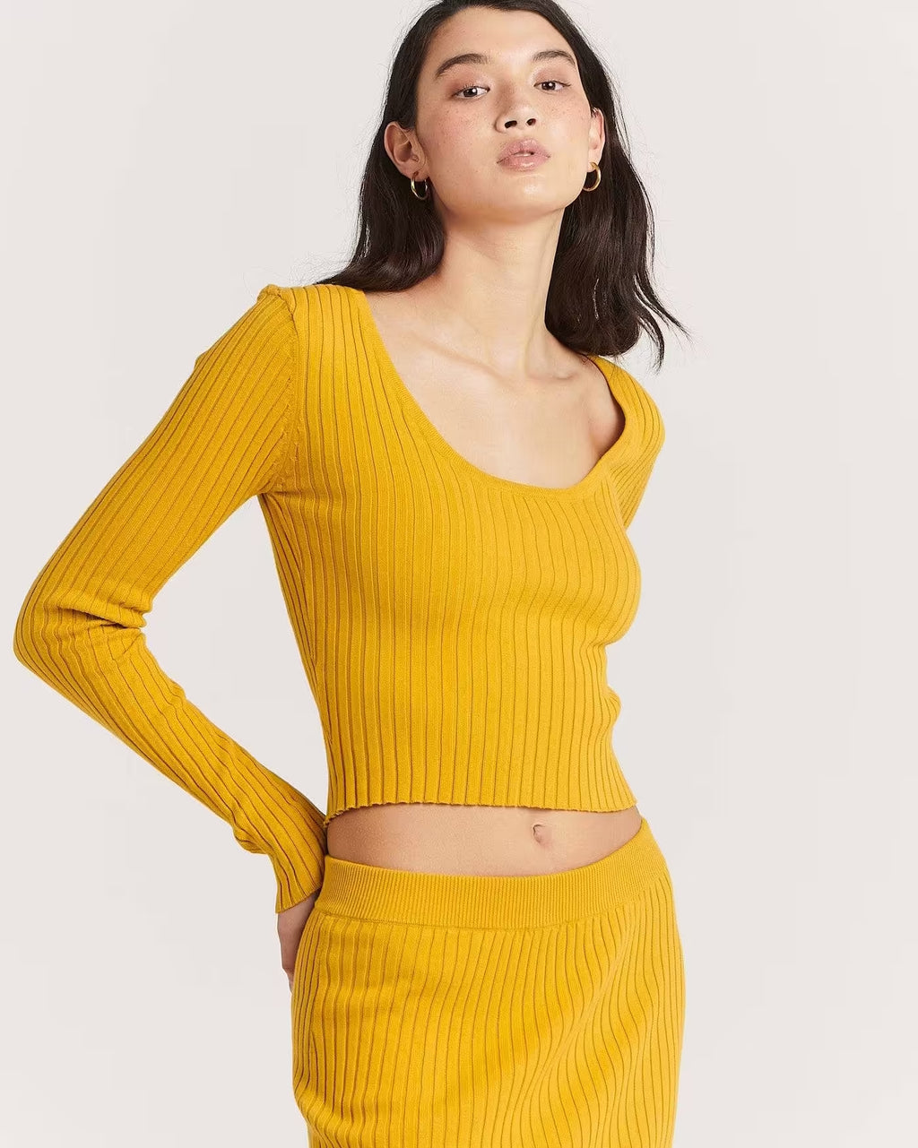 Golden ribbed long-sleeve scoop-neck crop top, close-up front