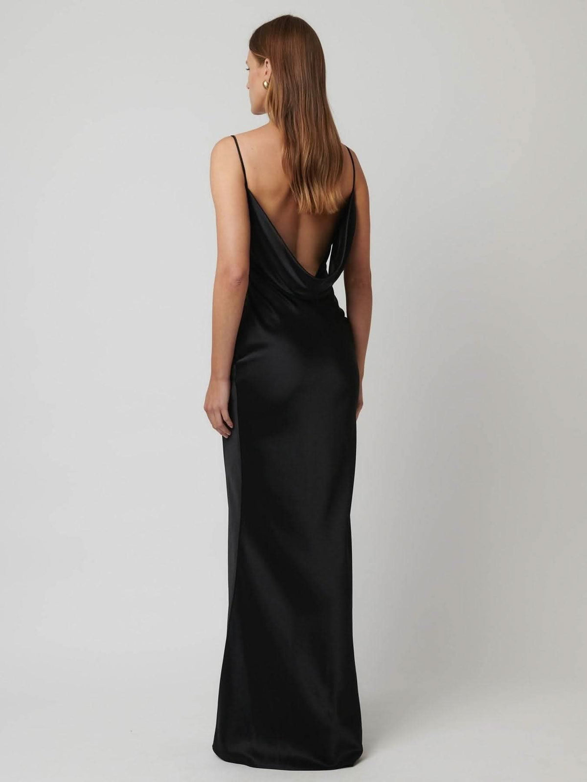 Black satin column gown with low back and thin spaghetti straps