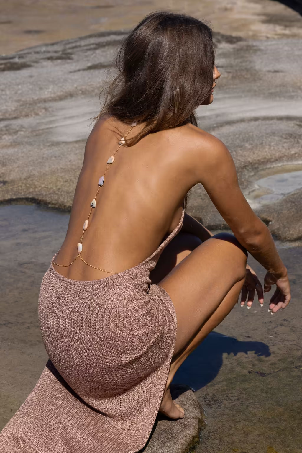 Taupe knit sleeveless maxi dress, open-back design with vertical strap accents