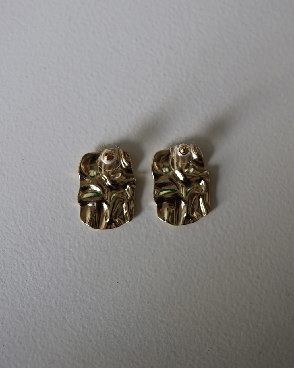 Gold textured square stud earrings with small round posts