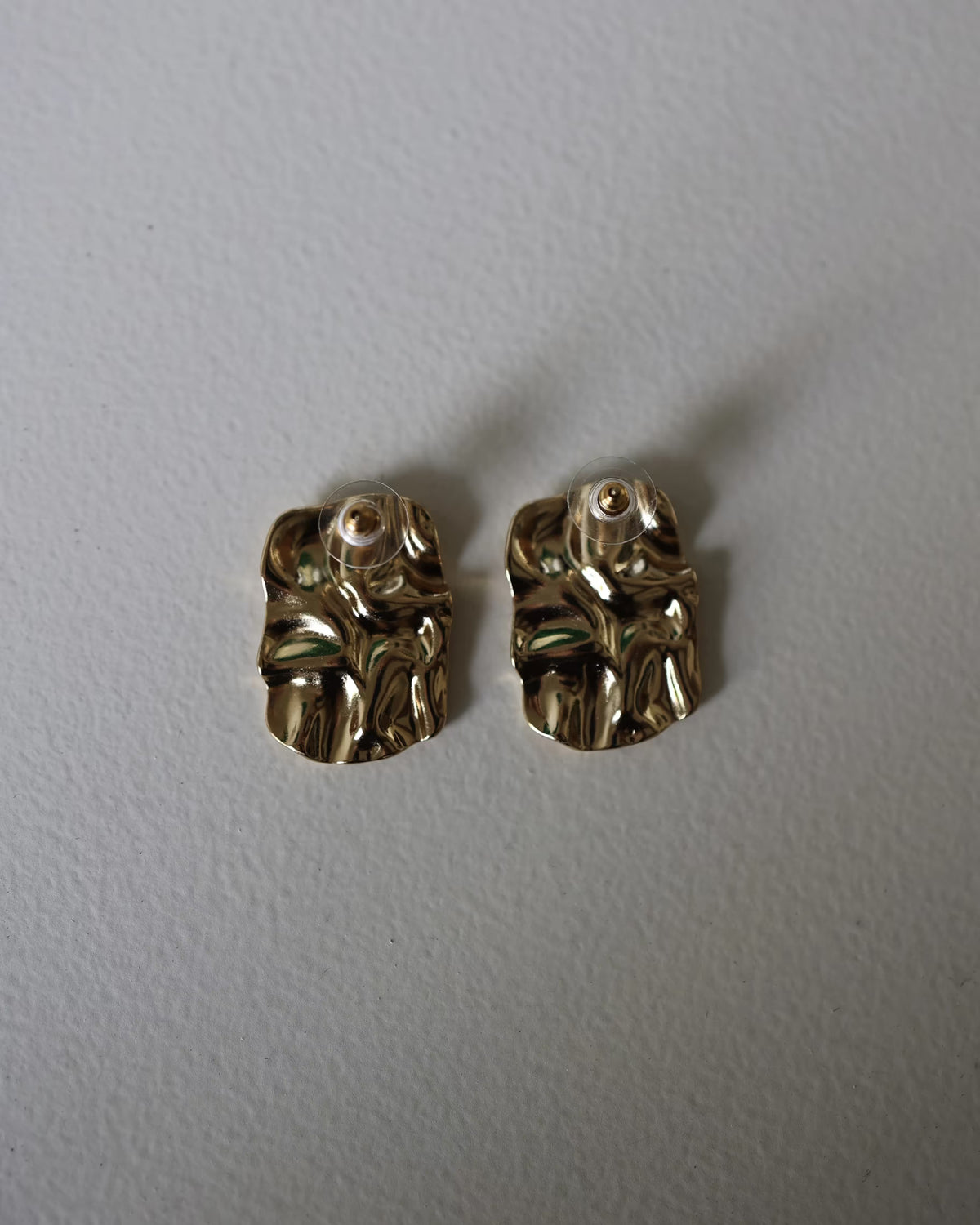 Gold textured square stud earrings with small round posts