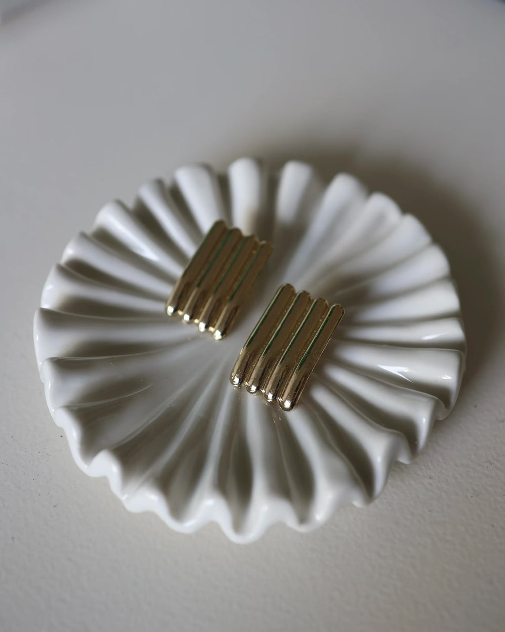 Gold ridged half-hoop earrings with vertical grooves, two-piece pair