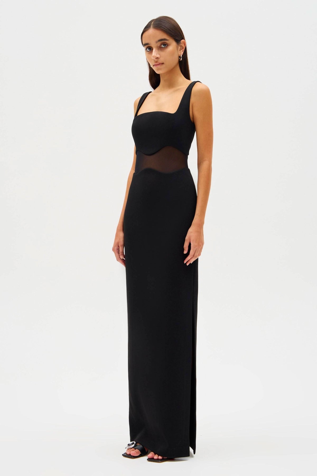 Black sleeveless maxi dress with square neckline and fitted mesh waist panel