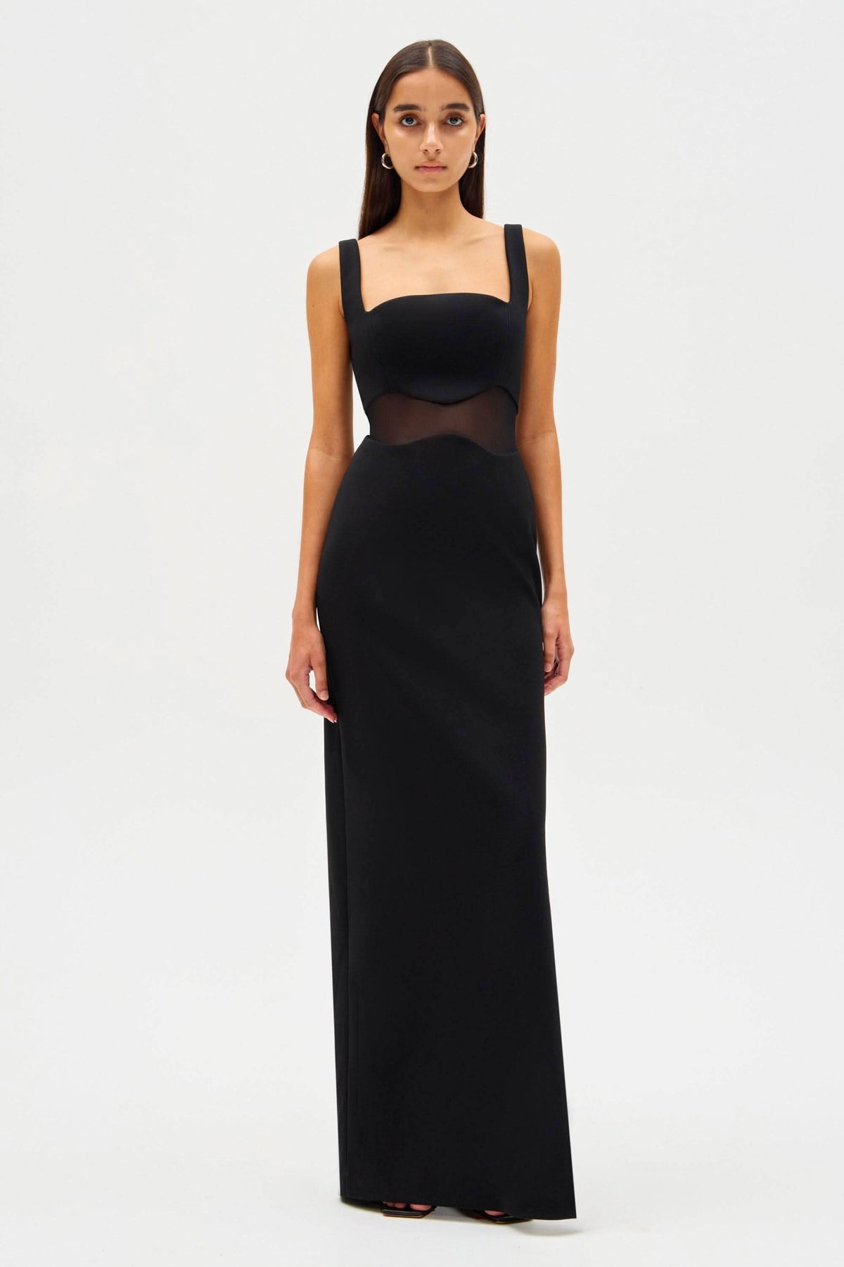 Black sleeveless maxi dress with square neckline, thin straps, and mesh mid-bodice